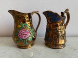 two vases that have been painted with flowers on them