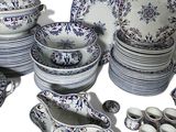 a large collection of blue and white plates and bowls