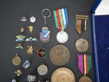many medals and medals on display on a table