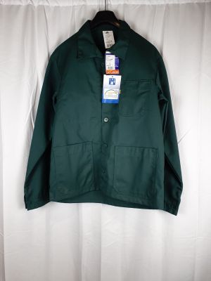 a close up of a green jacket hanging on a white curtain