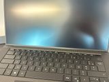 a laptop computer sitting on top of a desk