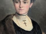 portrait of a woman in a black dress with a fur collar
