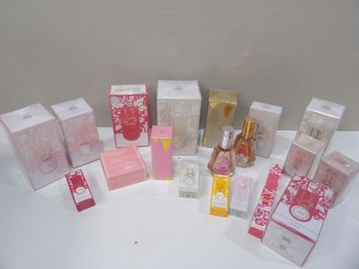 a lot of different types of perfumes on the table