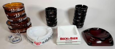 many different types of beer glasses and cups on the table