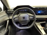 the interior of a car with a steering wheel and dashboard controls