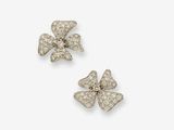 a pair of diamond flower earrings