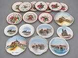 many plates with different designs on them on a table