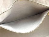the inside of a purse with a zipper on the inside