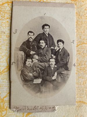 an old photo of a group of men posing for a picture