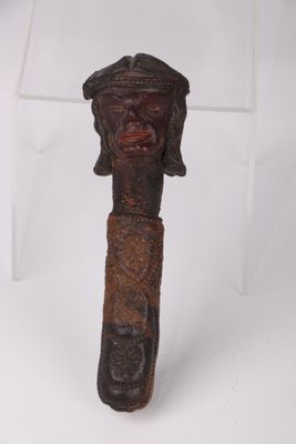 an image of a wooden stick with a face on top of it