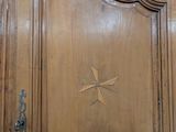 a large wooden door with a star on it