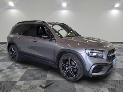 the mercedes gle suv is parked in a large room