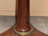 a small table with a marble top on a stand