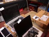 two laptops that are sitting on a table next to each other