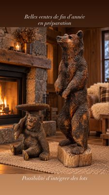 a statue of a bear and a bear cub in front of a fire place