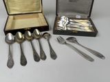 a lot of spoons and forks in a case