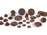 a group of wooden objects including a bowl, plate, and other items