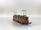 a toy train on a white surface with a white background