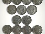 a close up of a bunch of coins on a white surface