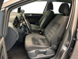 the interior of a car with the door open showing the front seats