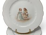 a plate with a picture of two children on it