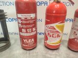 three fire extinguisors sitting next to each other on a table