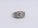 an image of a diamond ring on a white surface