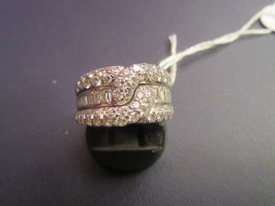a picture of a diamond ring on a black surface