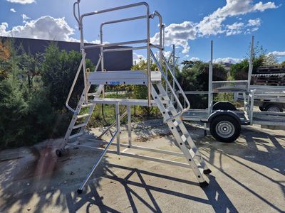 a ladder that is sitting in the middle of a parking lot