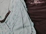 two pairs of women ' s clothing are displayed on a white surface