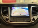 the dashboard of a car with a camera mounted to it ' s side