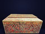 an image of a gold and red box on a black background