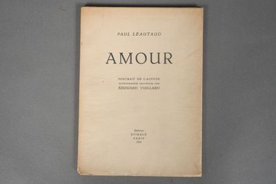 an old book sitting on top of a gray table