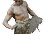 statue of a boy with a book in his hands