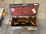 a box with tools in it sitting on the floor