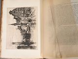 an open book with a drawing on it on a table