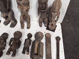 many different types of wooden figurines displayed on a table