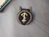a picture of a badge with a dollar sign on it