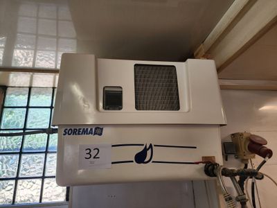 a white microwave sitting on top of a white cabinet