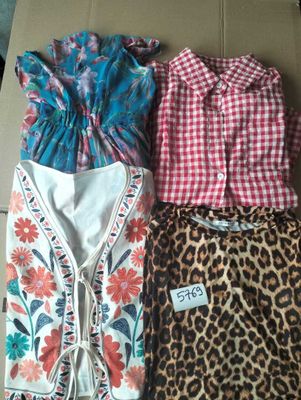 three different types of clothing are laid out on a table