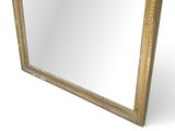 a gold framed mirror with a white background and a white background