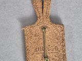 a small piece of cork that has a zipper on it