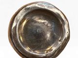 silver plate on white background with shadow and reflection