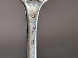 a close up of a fork with a dog on it