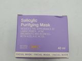 a box of facial mask sitting on a white surface