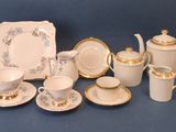 many different types of tea and coffee sets on the table