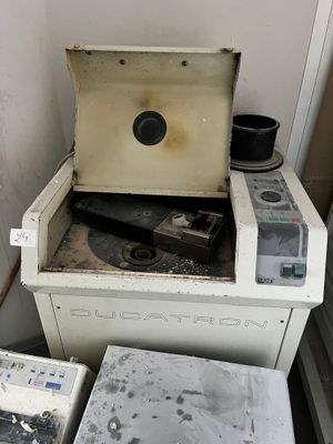 two old stoves and a trash can in a room