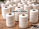 a bunch of white twine of twine on a wooden table