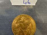 a close up of a gold coin with a label on it