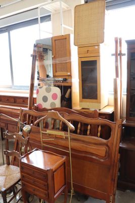 a lot of furniture in a room with a lot of windows